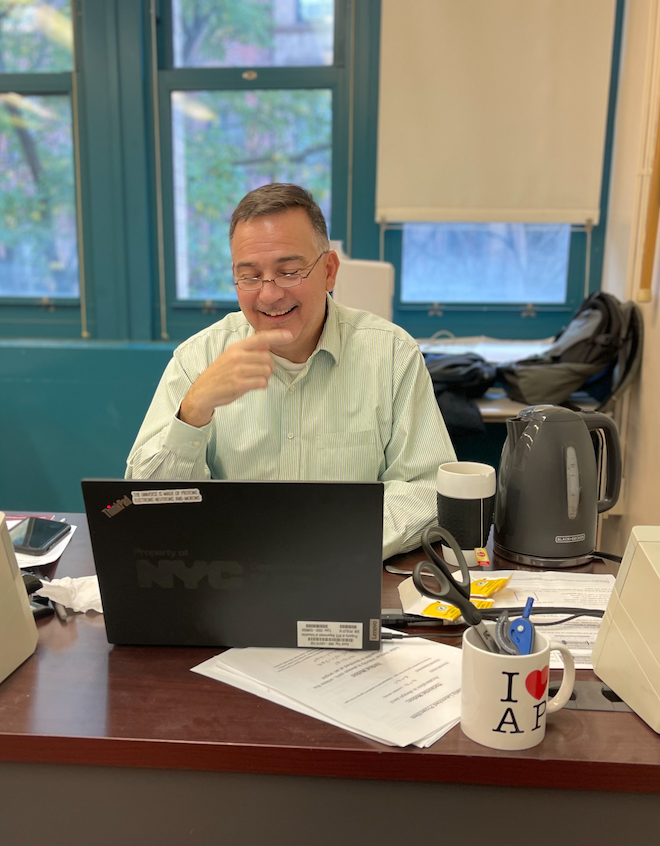 Science teacher Mr. Mezias contemplates his Jupiter grade book.