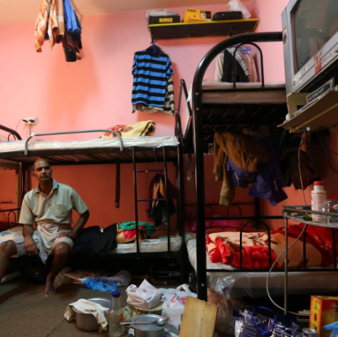An Indian labourer sits in his room at a camp
housing foreign workers in Doha. 
