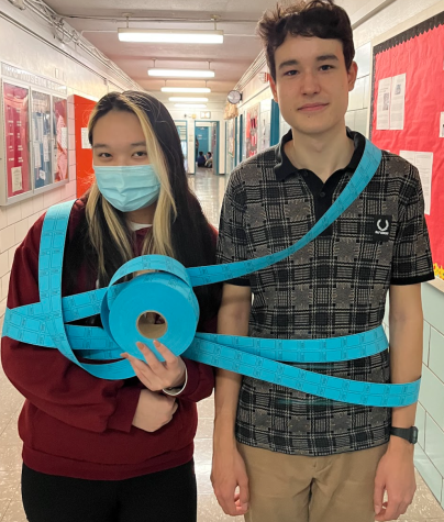 The Gallery’s Editors-in-Chief Cindy Jiang (l.) and Greyson Greischar (r.) wrapped in carnival tickets. Tickets will be available to purchase on Monday, Feb. 27.

