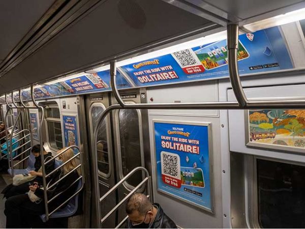 Photo taken from bluelinemedia.com website showing the excess amounts of ads subways are filled with
