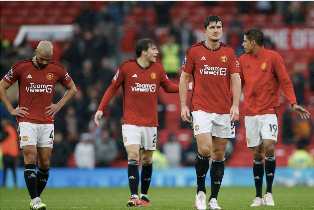 Manchester United players following their 3-0 loss to Manchester City. From left to right: Sofyan Amrabat (4), Victor Lindelöf (2), Harry Maguire (5), and Raphael Varane (19) 