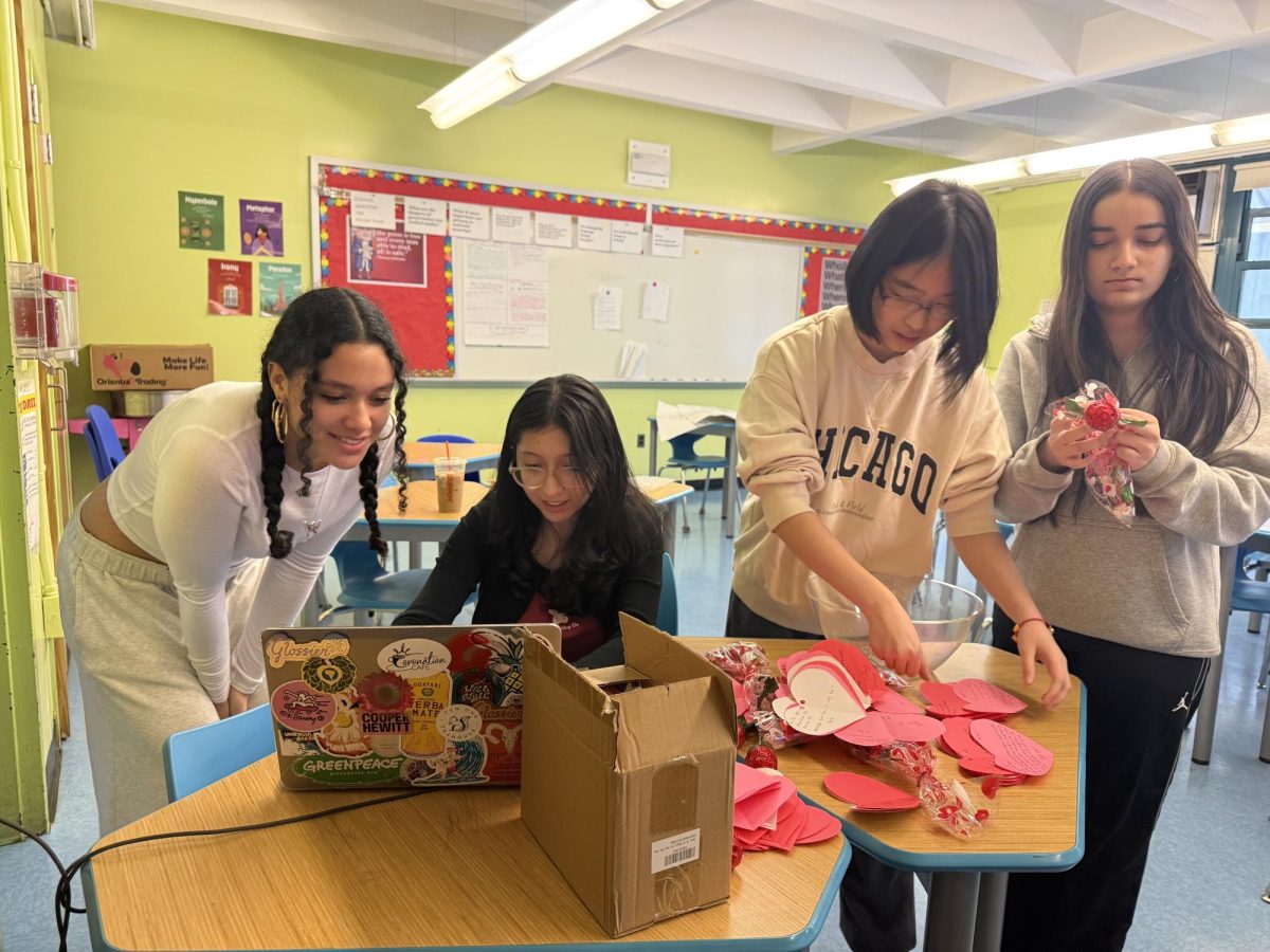 Gallery Staff members, Lily Kalb, Isabella Cosinga, Sarah Chen, Mannat Kaur (listed left to right), Preparing Candy Grams for the Day of Love