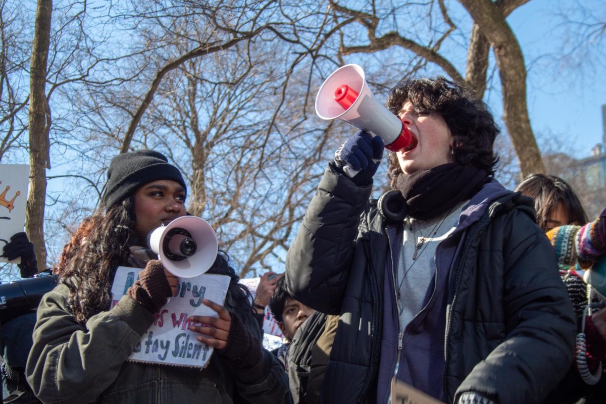 Museum School Juniors Abbie Alex (l.) and Emily Crepon-Wall (r.) protesting at the walkout.
