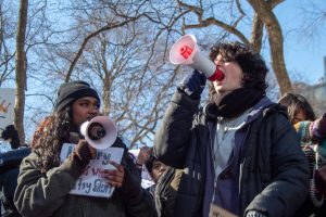 Museum School Juniors Abbie Alex (l.) and Emily Crepon-Wall (r.) protesting at the walkout.