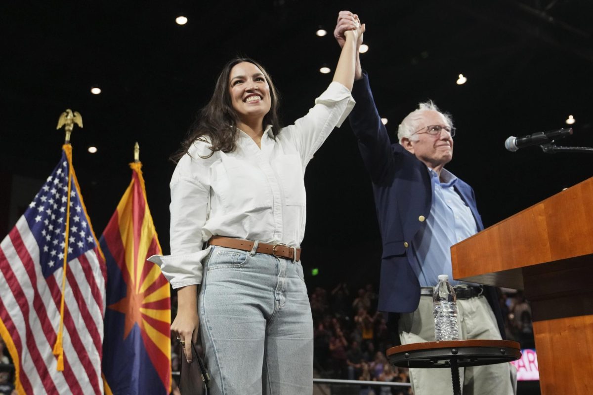 Liberal politicians Alexandria Ocasio-Cortez and Bernie Sanders at a progressive rally in Arizona.