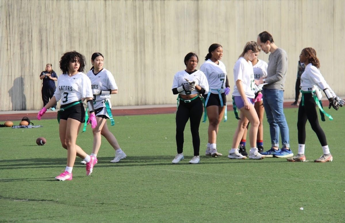 LMU Girls' Flag Football Team (left to right: Jaelani Galvez, Shu Ying Chen, Joy Hawkins, Jordan Thomas, Amelia Imerukaj, Keith Lau (Head Coach), Logan Cradel)