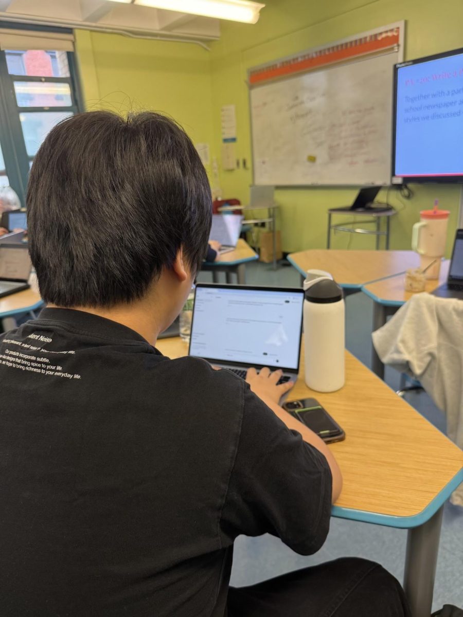 Junior Aiden Zhou uses ChatGPT to support his learning while completing classwork.